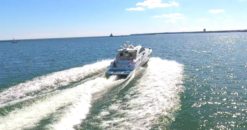 Slide: The Image of Sea Ray 470 Sundancer 2011 cruising on open water under a clear sky. - 25