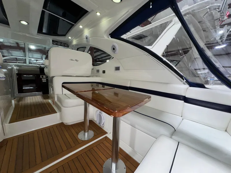 Slide: The Image of Luxurious interior of 2011 Sea Ray 470 Sundancer yacht with elegant seating and wooden table. - 40