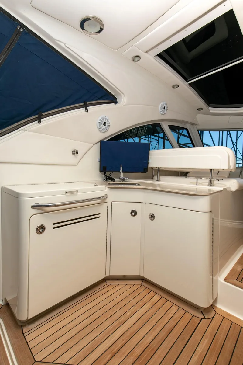Slide: The Image of 2011 Sea Ray 470 Sundancer yacht interior with sleek cabinetry and modern design. - 44