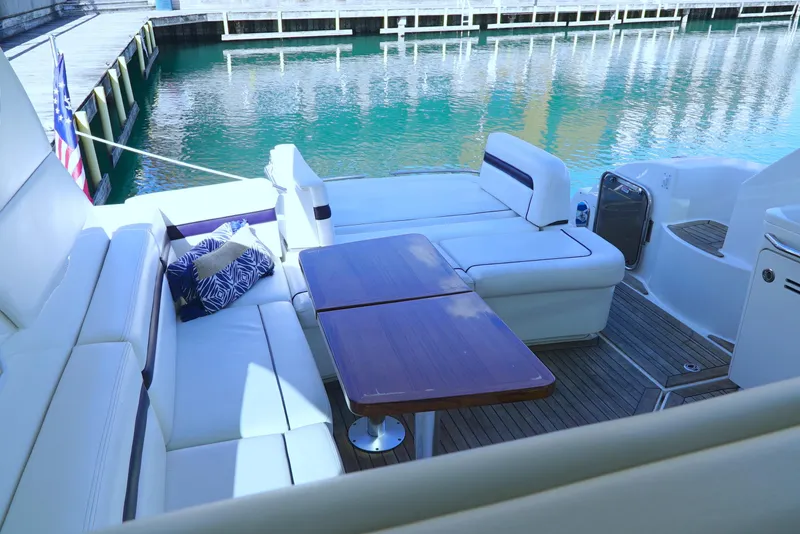 Slide: The Image of Luxurious 2011 Sea Ray 470 Sundancer yacht with elegant seating and wooden table. - 46