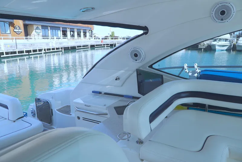 Slide: The Image of Interior view of 2011 Sea Ray 470 Sundancer yacht docked at marina. - 47