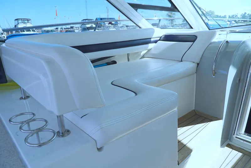 Slide: The Image of 2011 Sea Ray 470 Sundancer interior with white seating and sleek design. - 49