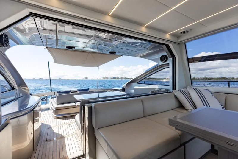 Slide: The Image of Luxurious interior of 2016 Pershing 62 yacht with ocean view and modern seating. - 19