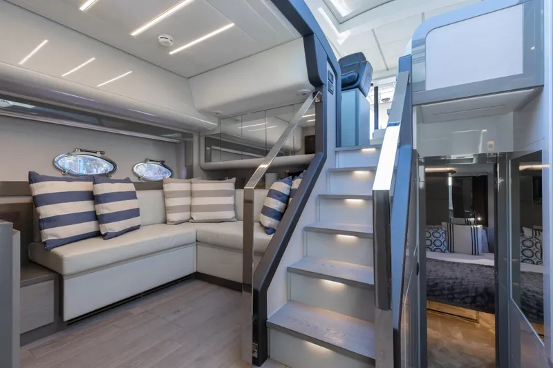 Slide: The Image of Luxurious interior of 2016 Pershing 62 yacht with modern seating and elegant staircase. - 21