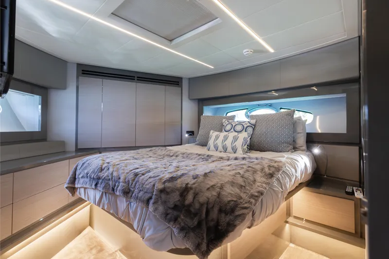 Slide: The Image of Luxurious bedroom interior of 2016 Pershing 62 yacht with modern design and cozy bedding. - 25