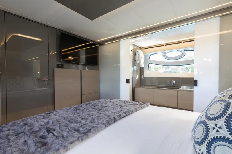 Slide: The Image of Luxurious interior of 2016 Pershing 62 yacht with modern bedroom and ensuite bathroom. - 26