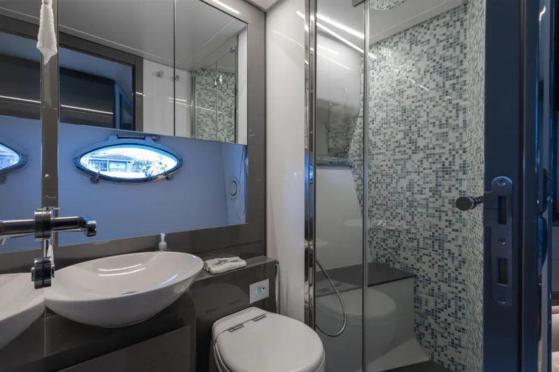 Slide: The Image of Luxurious bathroom in 2016 Pershing 62 yacht with modern fixtures and mosaic tiles. - 29