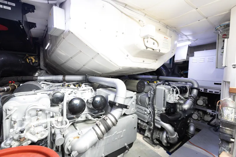 Slide: The Image of Engine room of 2016 Pershing 62 yacht showcasing advanced machinery and components. - 33