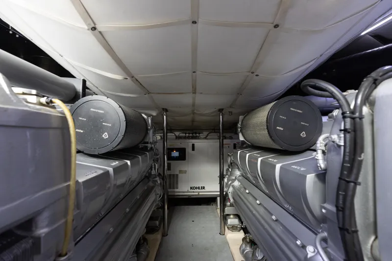 Slide: The Image of Engine room of 2016 Pershing 62 yacht with Kohler generator and dual engines. - 34