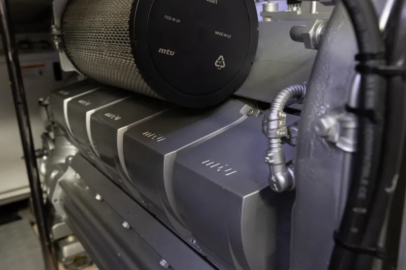 Slide: The Image of Engine compartment of 2016 Pershing 62 yacht, featuring MTU components. - 35