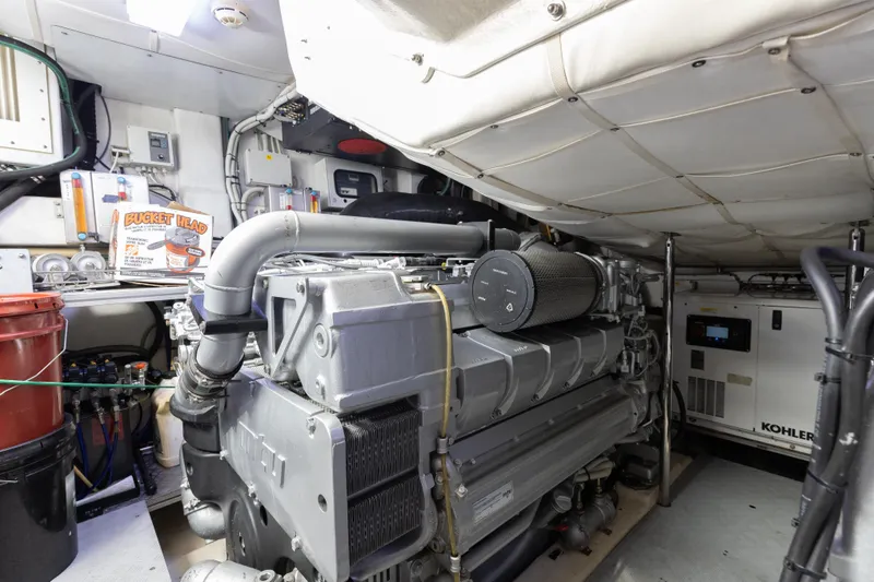 Slide: The Image of Engine room of 2016 Pershing 62 yacht with visible machinery and equipment. - 36