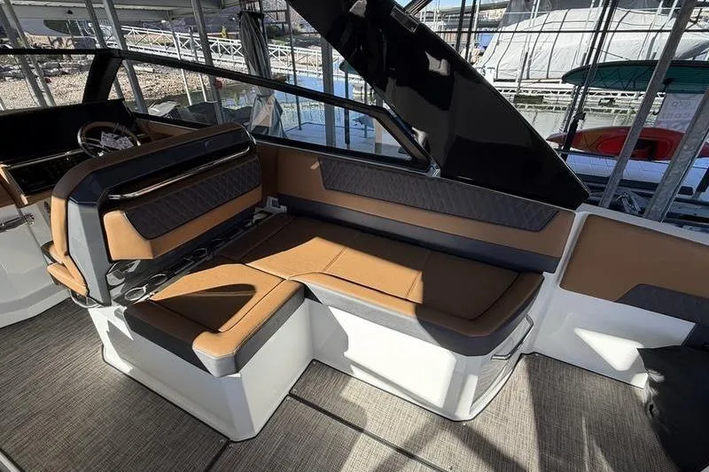 Slide: The Image of Luxurious interior of 2025 Cobalt R35 boat with brown leather seating. - 11