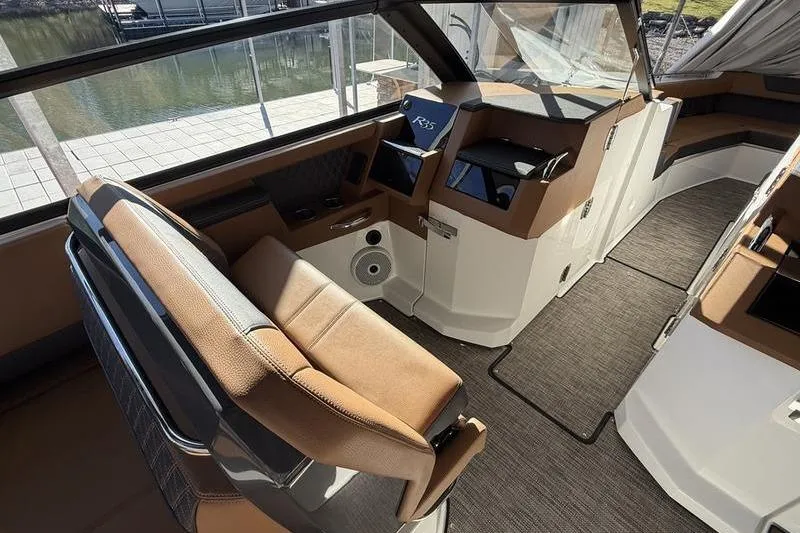 Slide: The Image of Luxurious interior of 2025 Cobalt R35 boat with modern seating and control panel. - 17