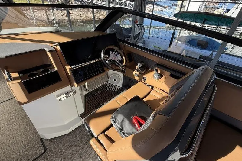 Slide: The Image of 2025 Cobalt R35 boat interior with modern dashboard and leather seating. - 18