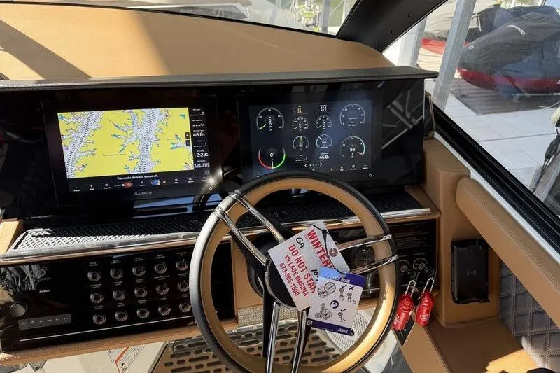 Slide: The Image of 2025 Cobalt R35 dashboard with navigation and control displays, featuring a modern steering wheel. - 19