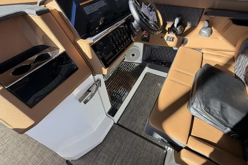 Slide: The Image of 2025 Cobalt R35 interior with tan leather seats and modern dashboard design. - 28