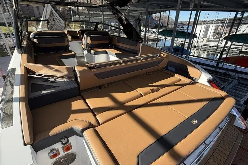 Slide: The Image of Luxurious 2025 Cobalt R35 boat interior with tan leather seating and modern design. - 3