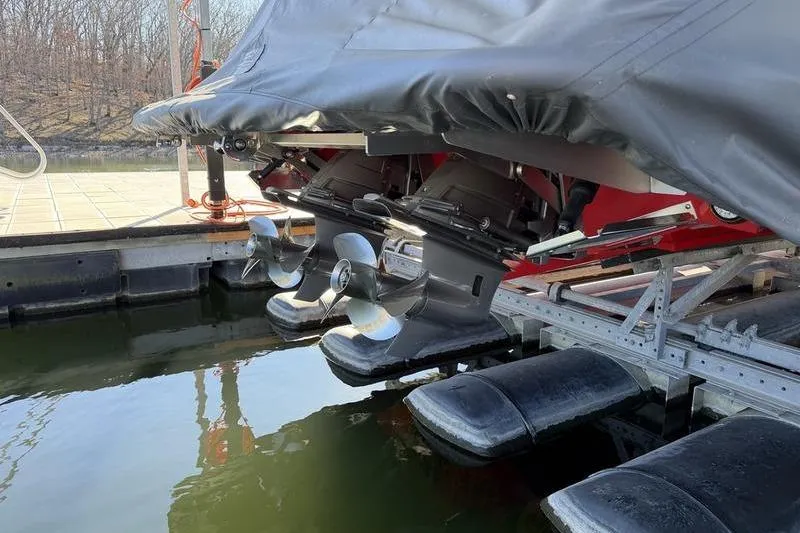 Slide: The Image of Covered Cobalt R35 boat with dual propellers on a dock, 2025 model. - 33