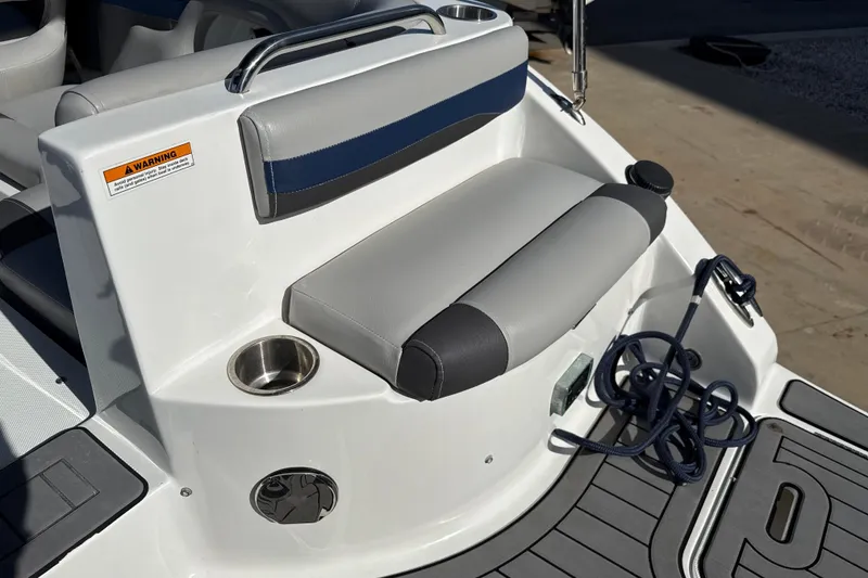 Slide: The Image of 2018 Hurricane SunDeck 2486 OB boat seating area with cup holder and rope. - 19