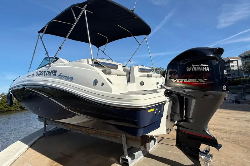 Slide: The Image of 2018 Hurricane SunDeck 2486 OB boat with Yamaha VMAX engine on a sunny day. - 2