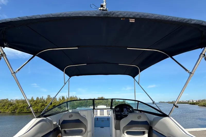 Slide: The Image of 2018 Hurricane SunDeck 2486 OB boat with canopy on a scenic river. - 22
