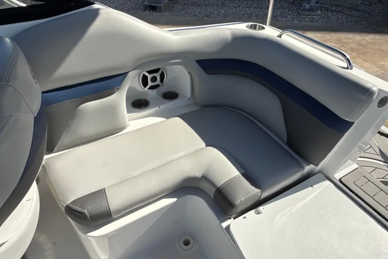 Slide: The Image of 2018 Hurricane SunDeck 2486 OB boat seating area with cup holders and speaker. - 30