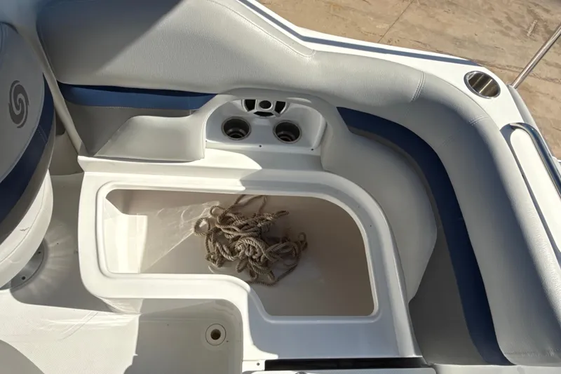Slide: The Image of 2018 Hurricane SunDeck 2486 OB boat interior with seating and storage compartment. - 32