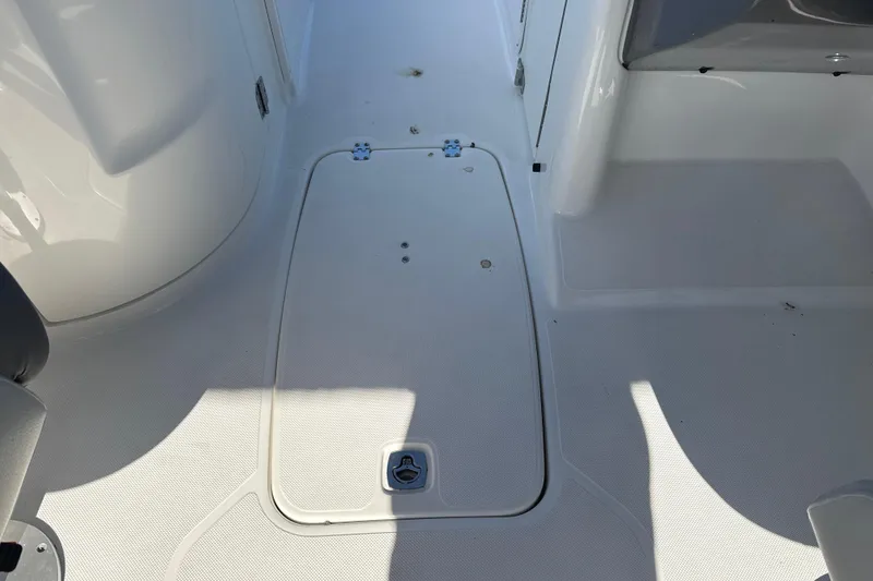 Slide: The Image of 2018 Hurricane SunDeck 2486 OB boat deck with storage compartment. - 38
