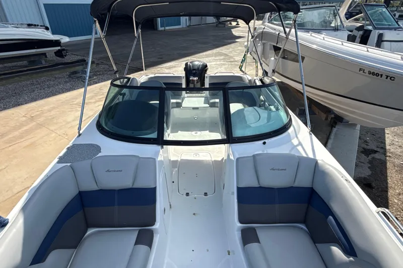 Slide: The Image of 2018 Hurricane SunDeck 2486 OB boat with spacious seating and sleek design. - 54