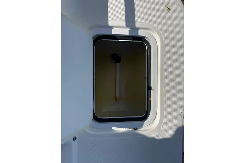 Slide: The Image of Open storage compartment on 2018 Hurricane SunDeck 2486 OB boat. - 58