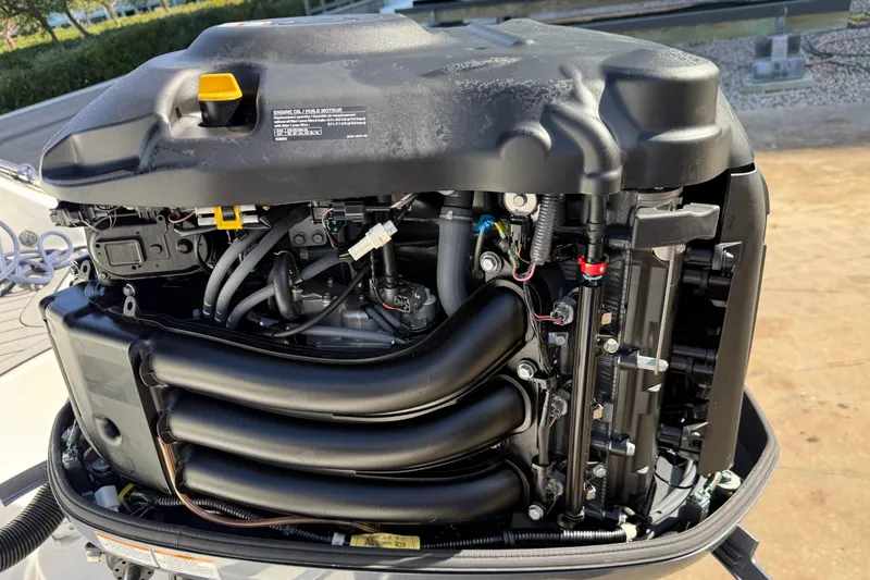Slide: The Image of 2018 Hurricane SunDeck 2486 OB outboard engine, detailed view of components and wiring. - 7