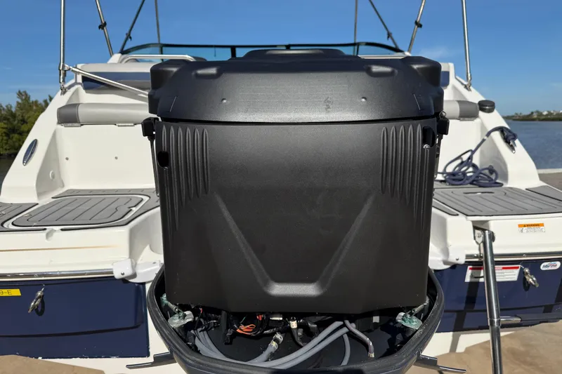 Slide: The Image of 2018 Hurricane SunDeck 2486 OB boat with outboard motor, docked on a sunny day. - 8