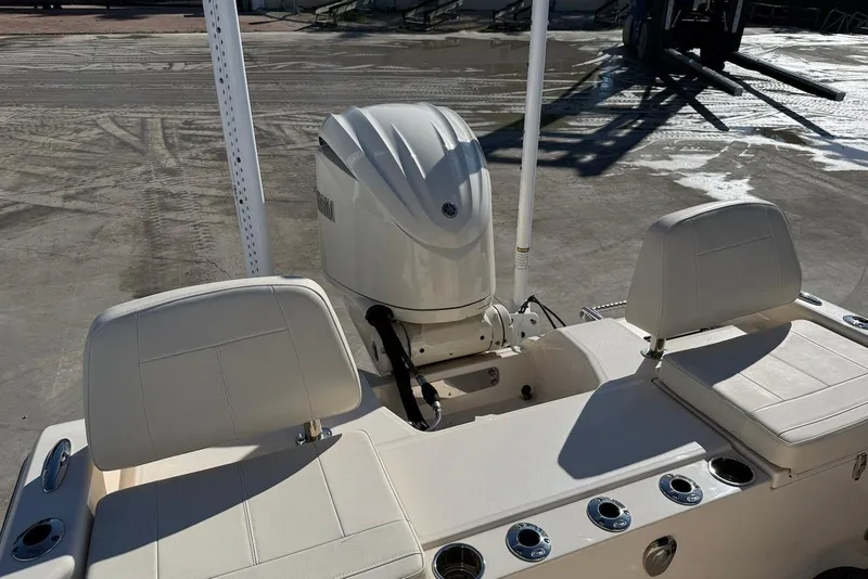 Slide: The Image of 2024 Grady-White 231 Coastal Explorer boat with Yamaha outboard motor, rear seating view. - 12