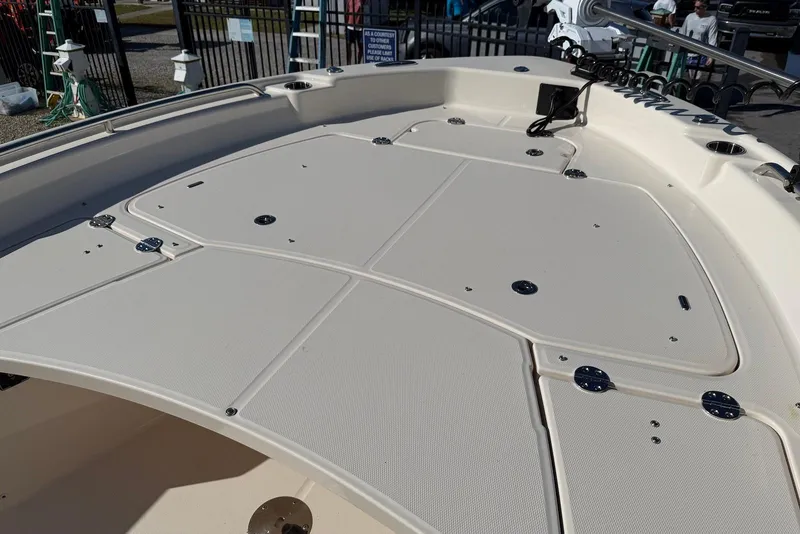 Slide: The Image of 2024 Grady-White 231 Coastal Explorer boat deck with storage compartments. - 14