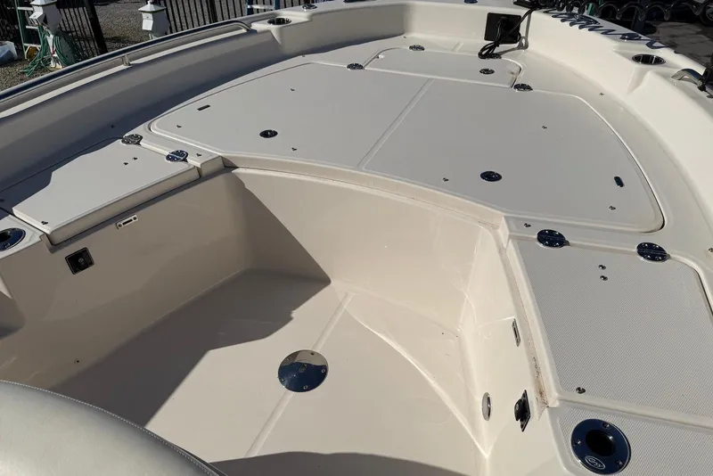 Slide: The Image of 2024 Grady-White 231 Coastal Explorer boat deck, featuring spacious storage compartments. - 15