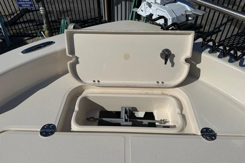 Slide: The Image of 2024 Grady-White 231 Coastal Explorer boat anchor compartment open. - 19