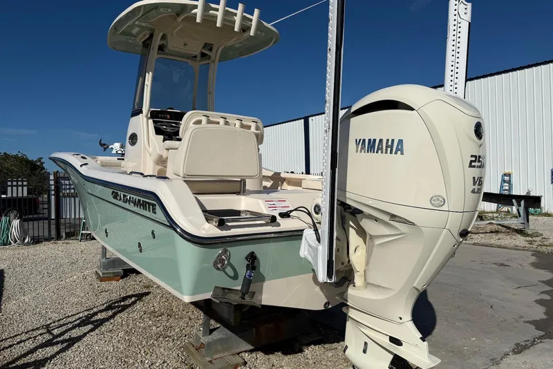 Slide: The Image of 2024 Grady-White 231 Coastal Explorer boat with Yamaha 250 V6 engine, docked outdoors. - 6