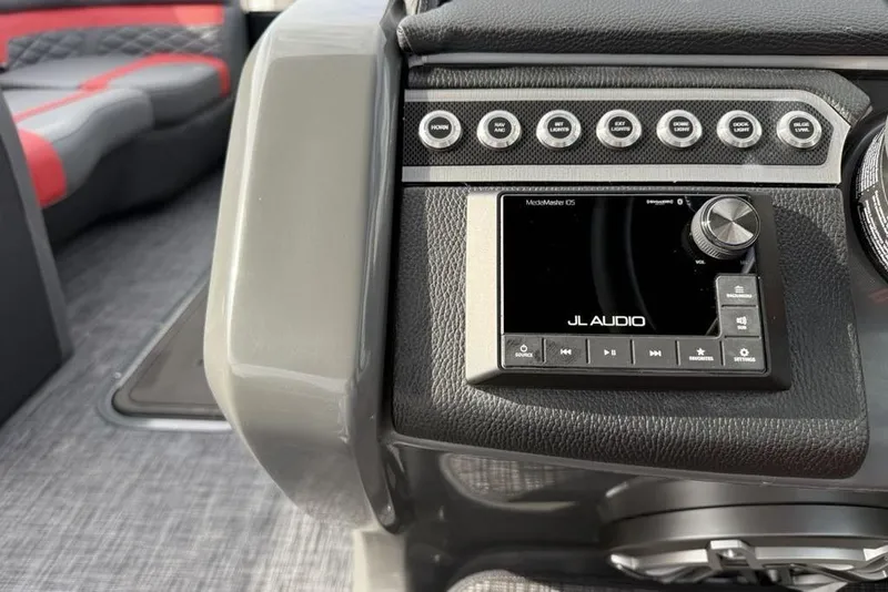 Slide: The Image of Throttle control lever on 2026 Godfrey Monaco 235 SFL boat dashboard. - 19