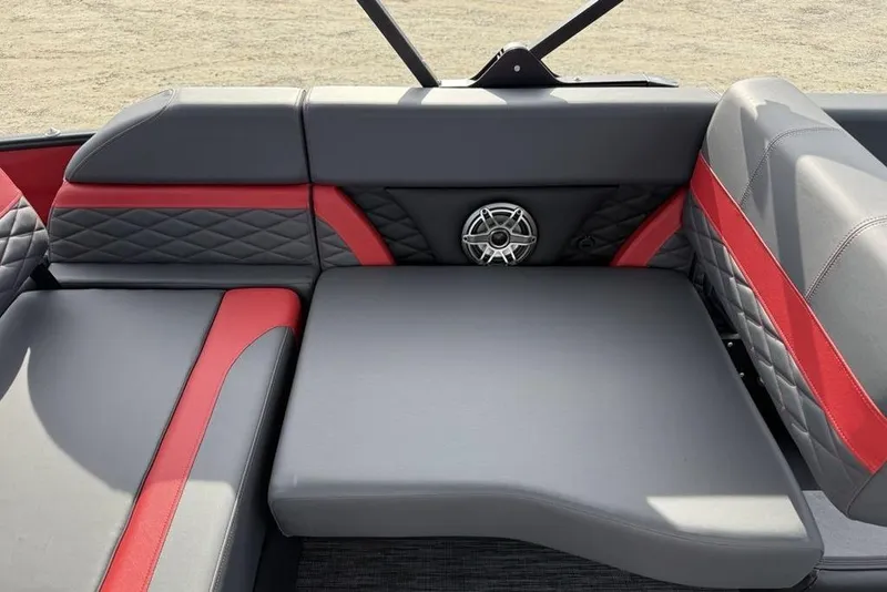 Slide: The Image of 2026 Godfrey Monaco 235 SFL boat seat with storage compartment, red and gray design. - 25
