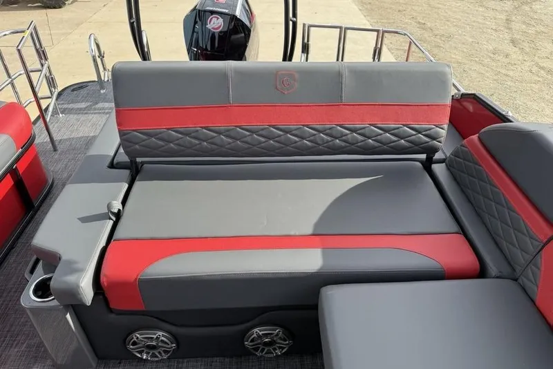 Slide: The Image of 2026 Godfrey Monaco 235 SFL boat interior with open storage compartment and stylish seating. - 26