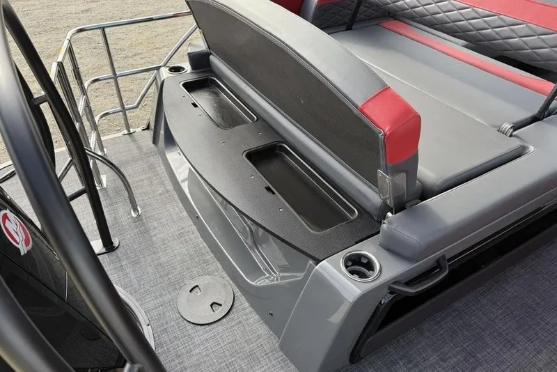 Slide: The Image of Interior seating of 2026 Godfrey Monaco 235 SFL pontoon boat, featuring gray and red upholstery. - 32