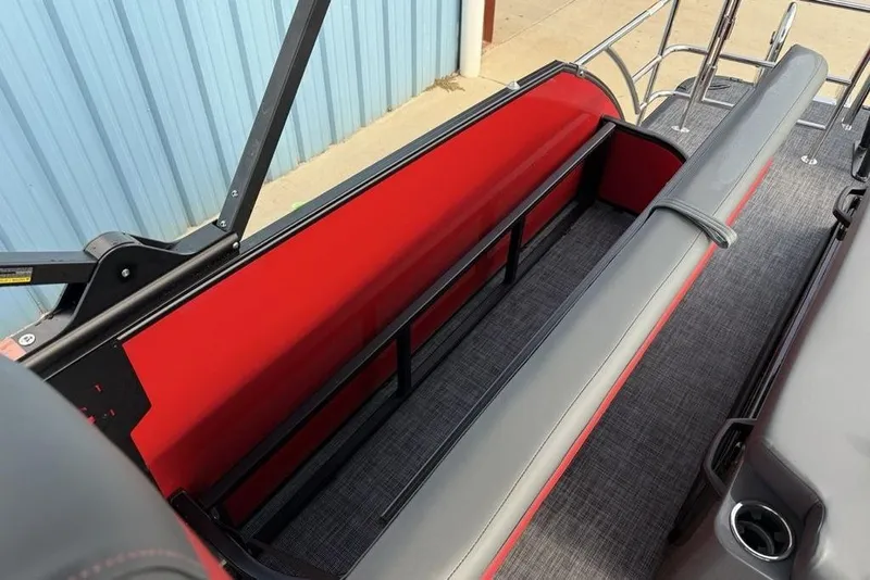 Slide: The Image of 2026 Godfrey Monaco 235 SFL boat with gray and red cushioned seating area. - 35