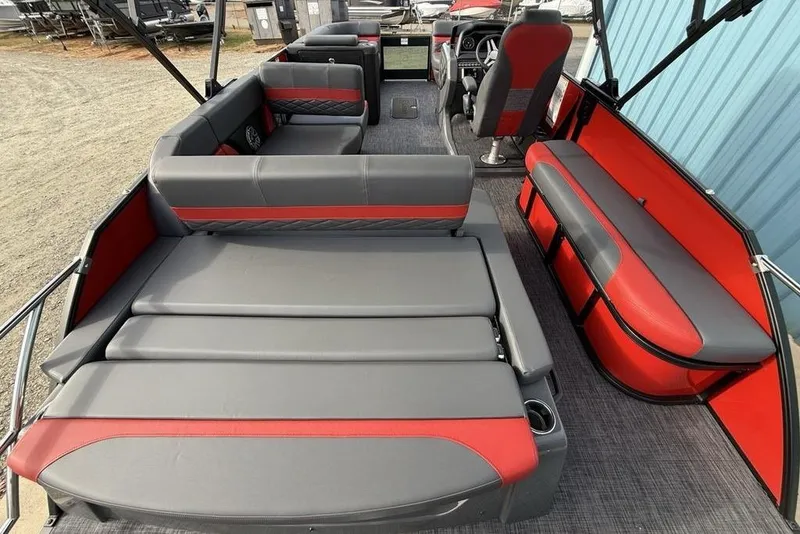 Slide: The Image of 2026 Godfrey Monaco 235 SFL pontoon boat interior with gray and red seating. - 37