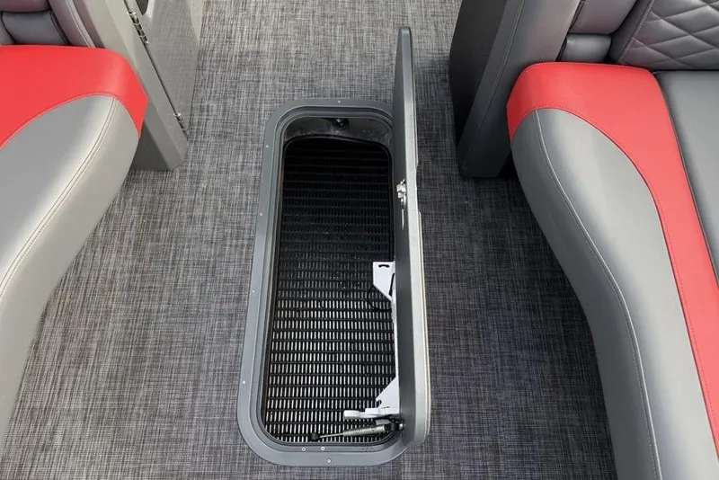 Slide: The Image of 2026 Godfrey Monaco 235 SFL boat interior with red and gray seating, speaker, and cup holders. - 5