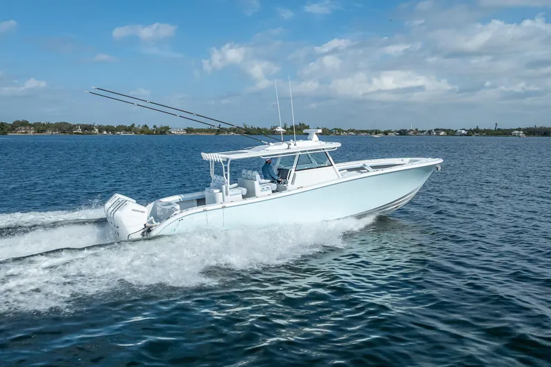 Slide: The Image of 2026 Yellowfin 42 Offshore boat cruising on open water under a clear sky. - 10