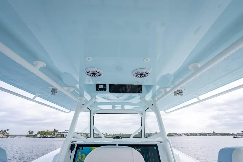 Slide: The Image of 2026 Yellowfin 42 Offshore boat interior with speakers and navigation system. - 15