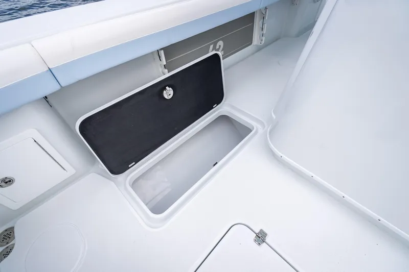 Slide: The Image of 2026 Yellowfin 42 Offshore boat storage compartment, open and spacious design. - 16