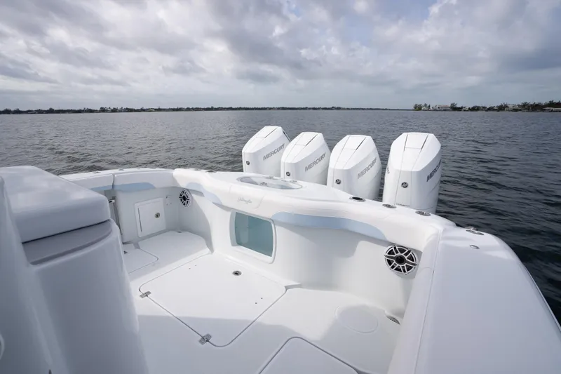 Slide: The Image of 2026 Yellowfin 42 Offshore boat with Mercury engines on calm water. - 18