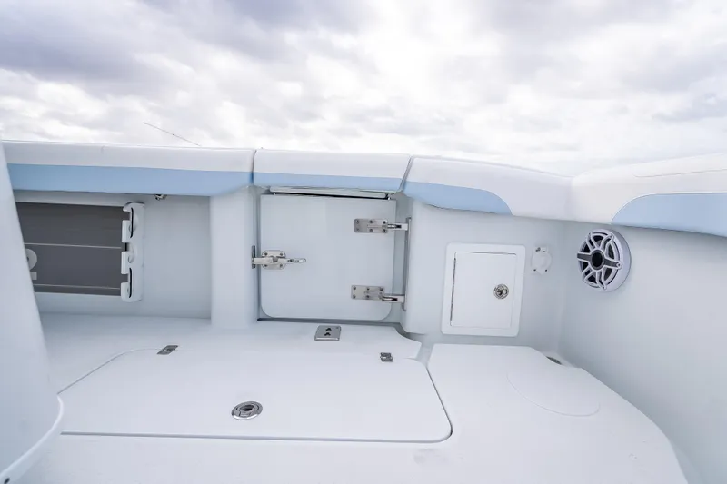 Slide: The Image of 2026 Yellowfin 42 Offshore boat interior with storage compartments and speaker. - 22