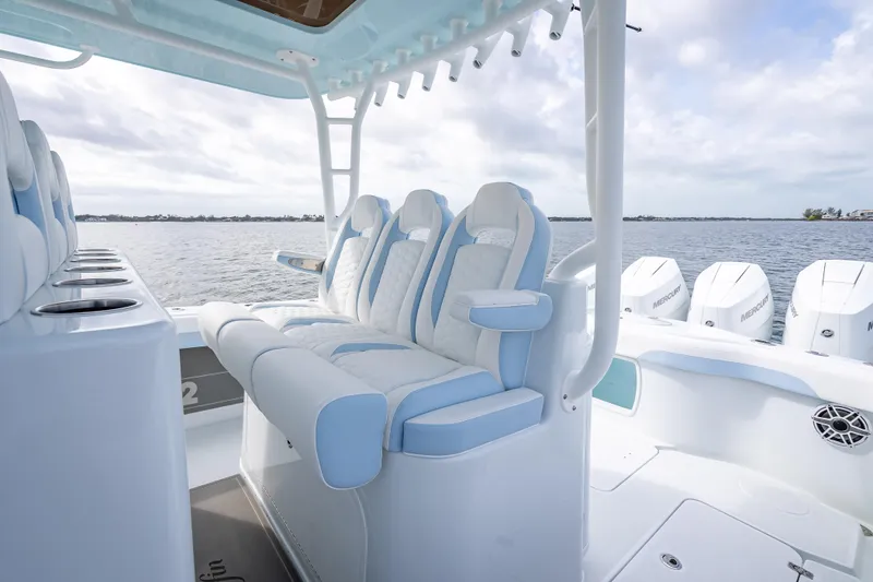 Slide: The Image of 2026 Yellowfin 42 Offshore boat interior with luxurious seating and multiple outboard engines. - 24
